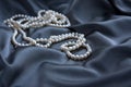 White pearls on blue satin Royalty Free Stock Photo