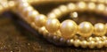 White pearls, female gift jewelry on brown background