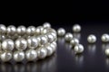 White pearls necklace on black Royalty Free Stock Photo