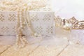 White pearls necklace, diamond tiara and perfume bottle Royalty Free Stock Photo