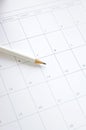 White pencil on blank calendar Royalty Free Stock Photo