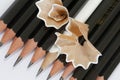 White pencil in a group of black pencils Royalty Free Stock Photo