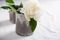 White peony in gray handmade cup