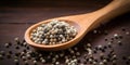 White Pepper Pile In Wooden Spoon. Closeup Dry Peppercorn Heap. Spice Condiment On Wood Table. Organic Seasoning. AI generated