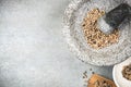 White peppercorn seed in granite mortar or pestle