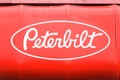White Peterbilt sign on a red awning