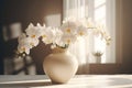 White Phalaenopsis orchid in a beautiful vase on a table in a classic interior.