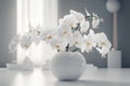 White Phalaenopsis orchid in a beautiful vase on a table in a white modern interior.