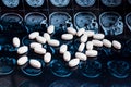 White pharmaceutical medicine pills on magnetic brain resonance scan mri background. Pharmacy theme, health care