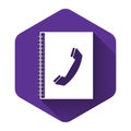 White Phone book icon isolated with long shadow. Address book. Telephone directory. Purple hexagon button Royalty Free Stock Photo