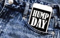 White phone with text Hump Day lies in jeans pocket