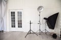 White photo studio interior with flashes and racks Royalty Free Stock Photo