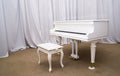 White Piano on the stage of concert hall Royalty Free Stock Photo