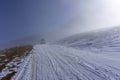 The white pick up truck is riding on snow at a foggy day in Antalya, Turkey Royalty Free Stock Photo