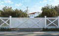 White picket fence against blue sky Royalty Free Stock Photo