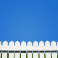 White picket fence and blue sky Royalty Free Stock Photo