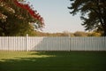 A white picket fence with climbing roses
