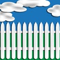 White Picket Fence with Clouds Royalty Free Stock Photo