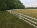White Picket Fence Over Barley Field