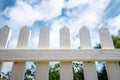 White picket fence under a blue sky Royalty Free Stock Photo