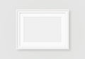 White picture frame, blank horizontal photo frame. Realistic empty poster border, gallery painting frame hanging on wall Royalty Free Stock Photo