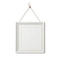 A white picture frame hanging from a chain Royalty Free Stock Photo