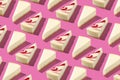 White piece slice cheesecake pattern on pink background