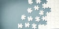 White puzzle pieces on grey background Royalty Free Stock Photo