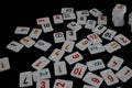 White pieces of rummy on a black background Royalty Free Stock Photo