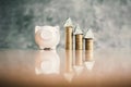 White piggy bank and coin on wood Royalty Free Stock Photo