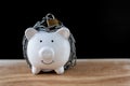 White Piggy bank locked, chained with black background, Protect savings, Protect capital, Protect retirement fund concept Royalty Free Stock Photo