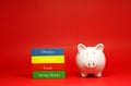 White Piggy bank with wooden block stack isolated on red  background with text message -  Fund  Tax return Dividen Saving money - Royalty Free Stock Photo