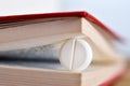 White pill between book pages Royalty Free Stock Photo