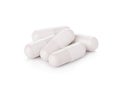 White pill capsules on white background Royalty Free Stock Photo