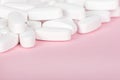 White pill closeup the pink Royalty Free Stock Photo