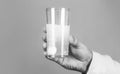 White pill and a glass of water in man hands. Health concept. Close up of man holding a pill Royalty Free Stock Photo