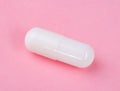 White Pill on Pink Background Royalty Free Stock Photo