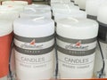 White pillar candles display in store with german branding Royalty Free Stock Photo