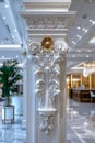 A white pillar with decorative carving on it in a lobby, AI Royalty Free Stock Photo