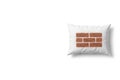 A white pillow with a brick wall pattern. Space for text. Royalty Free Stock Photo