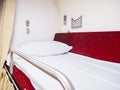 White pillow on upper storey bed in Thai second class sleeper cabin train