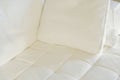 White Pillow on a White Sofa