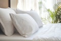 White pillows on the bed in the bedroom. Soft focus.