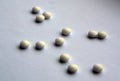 White pills on white with blur Royalty Free Stock Photo