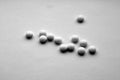 White pills on white with blur in black and white Royalty Free Stock Photo