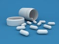 White pills and bottle on blue background
