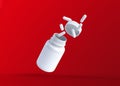 White pills fly out of a flying bottle on red background with copy space Royalty Free Stock Photo