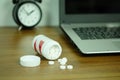 White pills and medicine bottles, paracetamol on the desk wooden table, Headache medicine Vitamin And Dietary Supplements Royalty Free Stock Photo