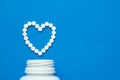 white pills in the shape of a heart Royalty Free Stock Photo