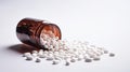 White pills spilling out of a brown bottle Royalty Free Stock Photo